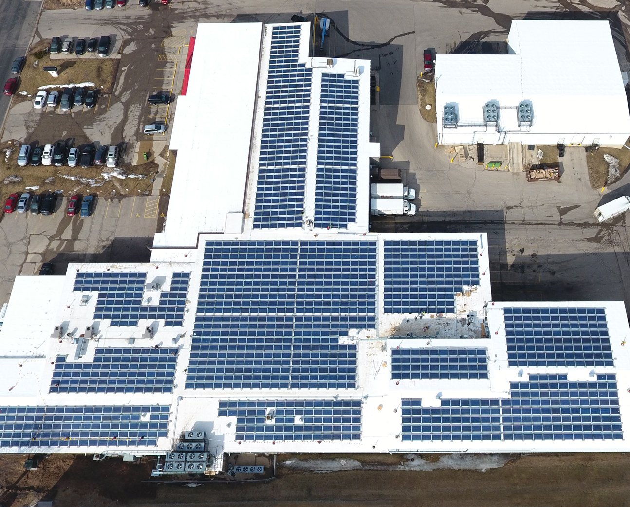 An aerial view of rooftop solar panels, representing SunPeak’s work as a commercial solar installation company.